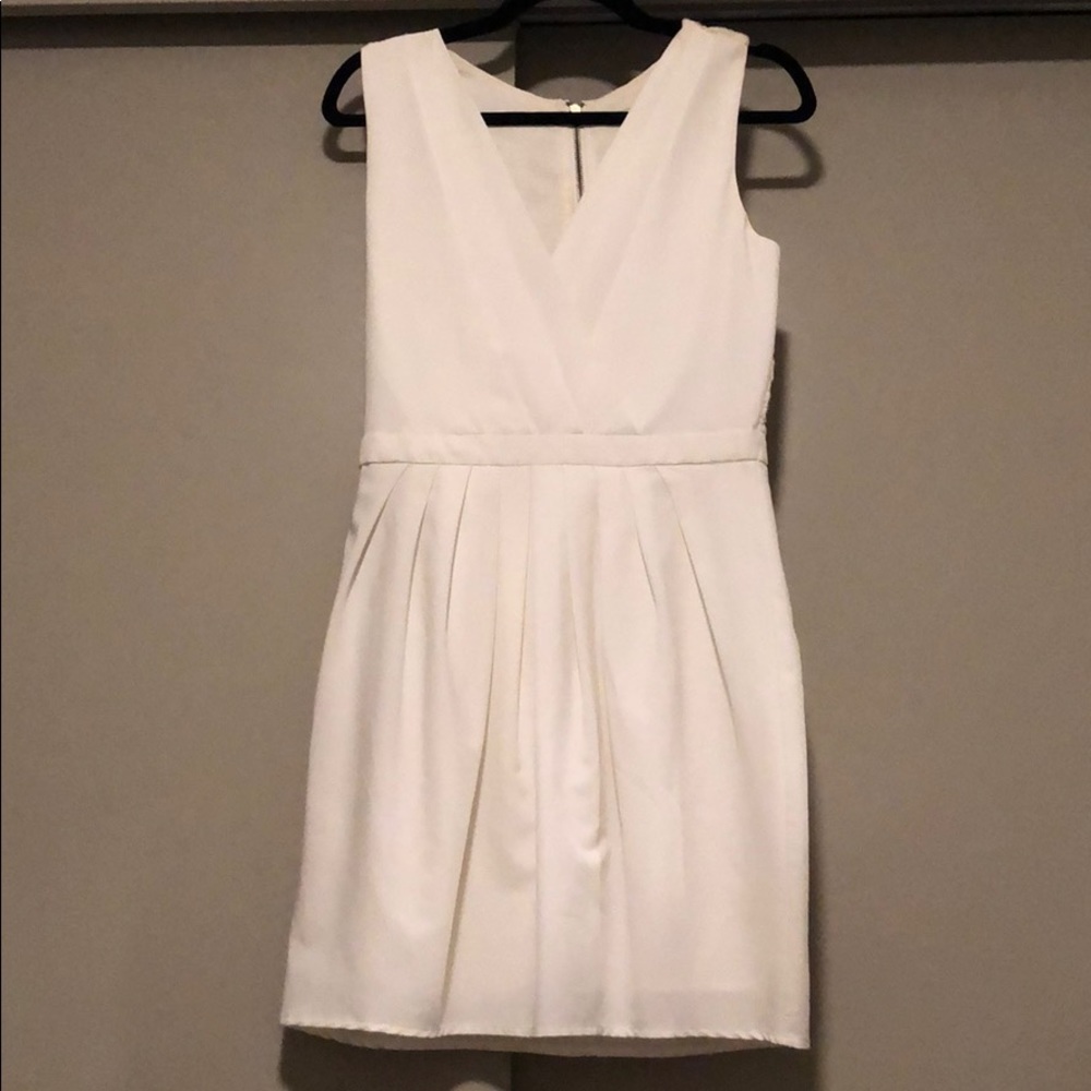 Cream v neck dress with beautiful rose back detail